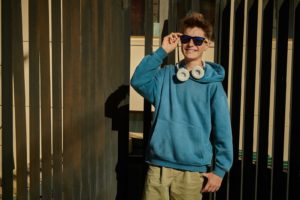 A teen wearing sunglasses smiles brightly while posing for the camera. Therapy for teens in South Jersey can offer support from the comfort of home with online therapy for teens in New Jersey. Learn more about teen counseling in South Jersey form a therapist in Swedesboro, NJ today! 08085
