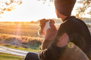 A teen sits with their dog as they watch the setting sun. This could symbolzie the hope felt after completing therapy for teens in South Jersey. Learn more about therapy for anxiety in South Jersey and other services by contacting a therapist for teens in Swedesboro, NJ. We offer therpay for anxiety in Glassboro, NJ and more! 08028 | 08056