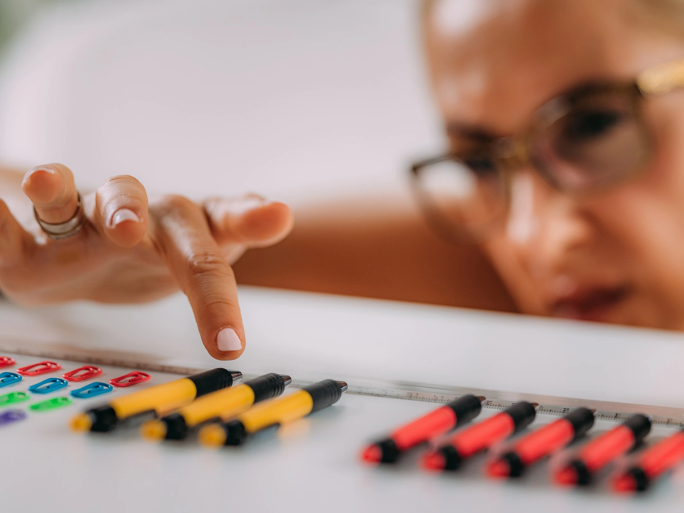 a woman pointing at a number on a table