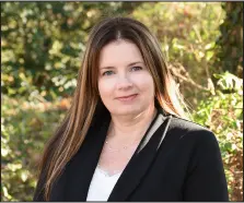 a woman with long hair and a black jacket