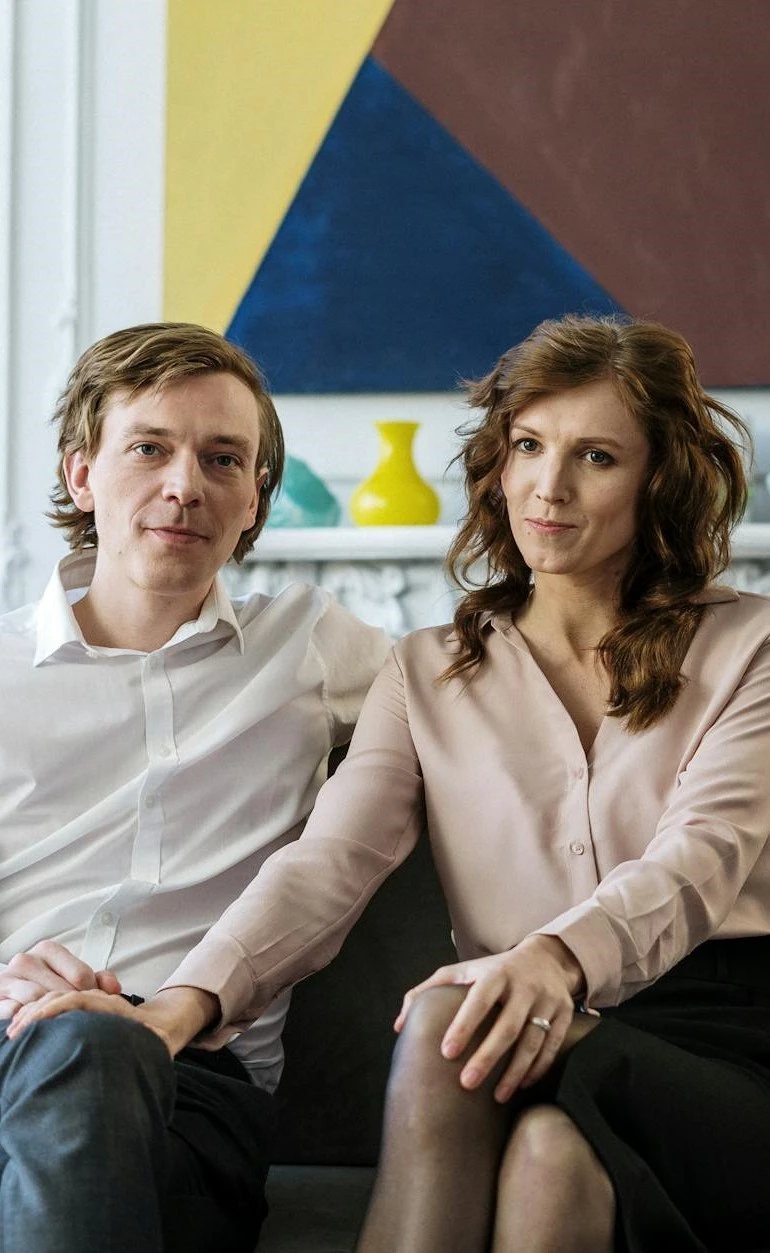 a man and a woman sitting on a couch