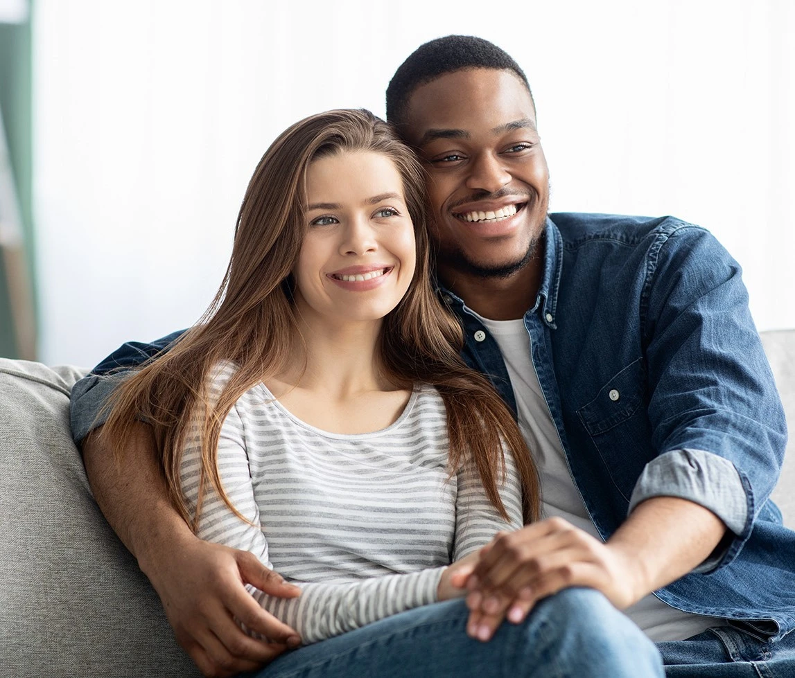 a man and a woman sitting on a couch