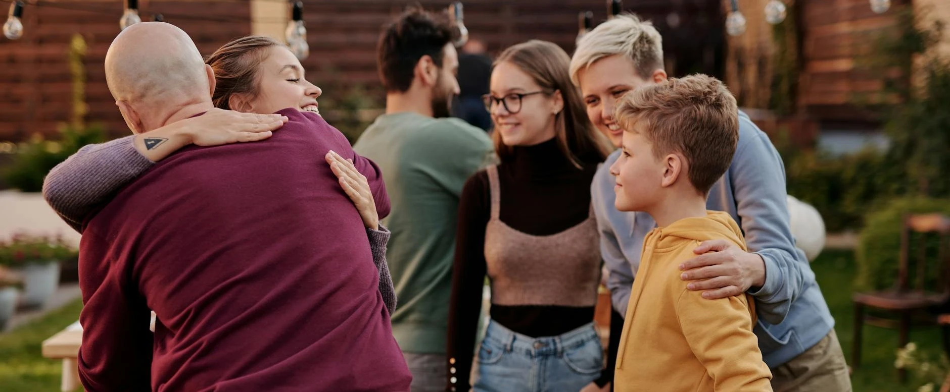 a group of people standing around each other