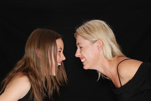 a couple of women standing next to each other