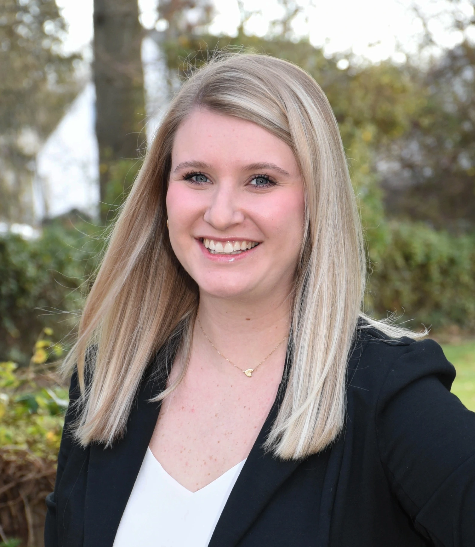 a woman named Julia Donelson with blonde hair and a black jacket