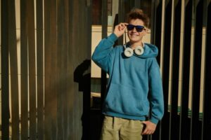 A teen wearing sunglasses smiles brightly while posing for the camera. Therapy for teens in South Jersey can offer support from the comfort of home with online therapy for teens in New Jersey. Learn more about teen counseling in South Jersey form a therapist in Swedesboro, NJ today! 08085