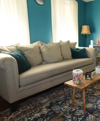 a living room filled with furniture and a fire place