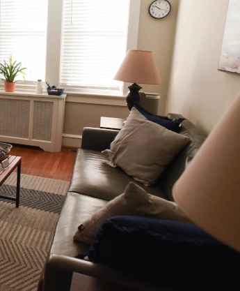 a living room filled with furniture and a flat screen tv