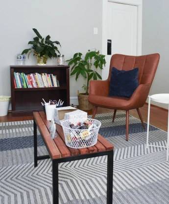 a living room with two chairs and a coffee table