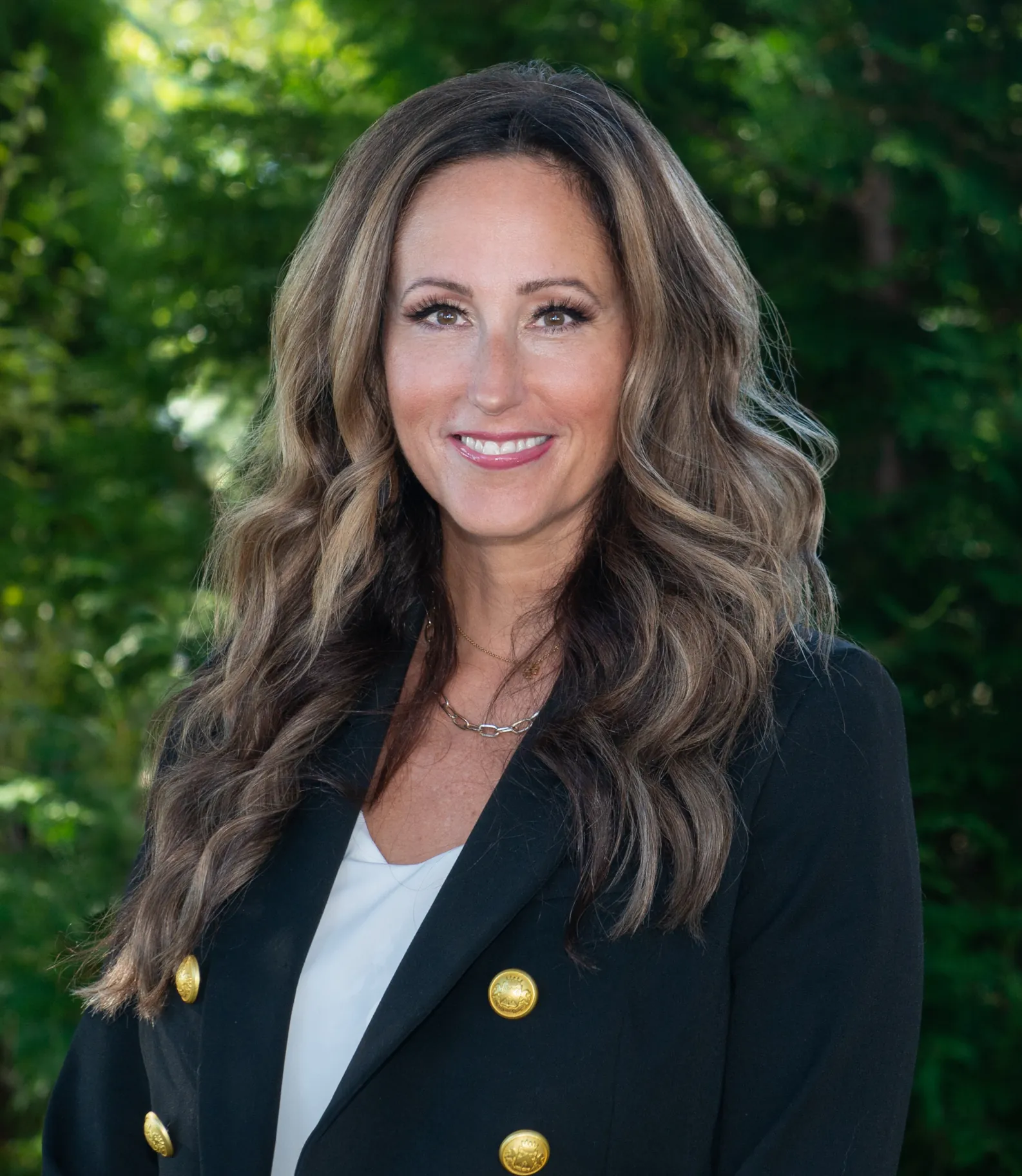 a woman named Michelle Dunk with long hair wearing a black jacket